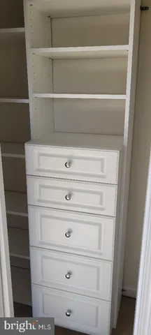 a white bath tub sitting next to a white toilet