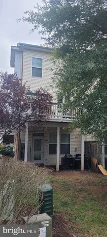 a front view of a house with a yard and a garage