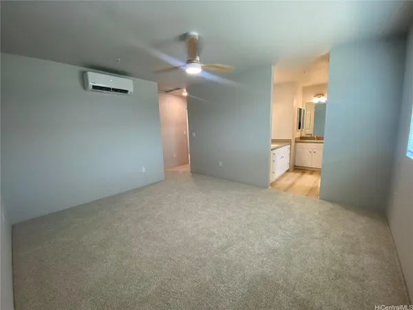 a view of an empty room with a bathroom