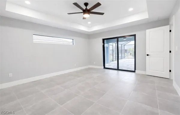 a view of an empty room with a ceiling fan
