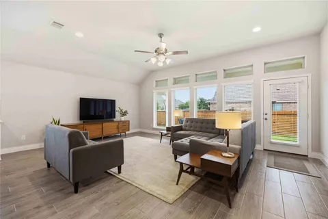 a living room with furniture and a table