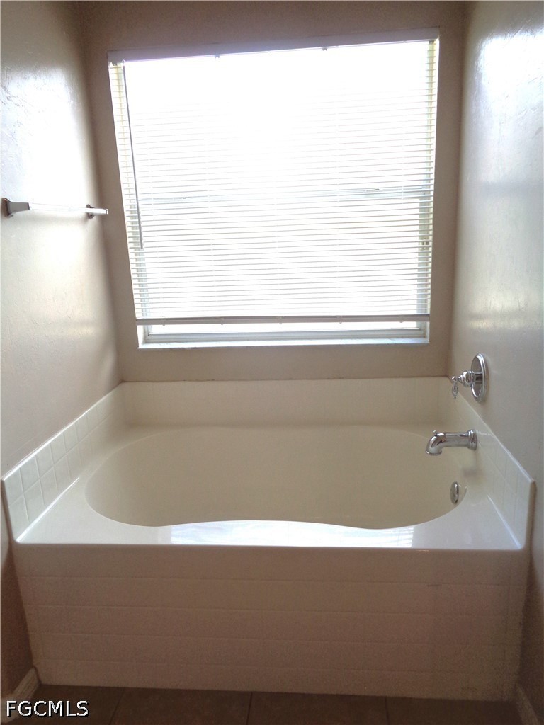 2463 Nature Pointe Loop Fort Myers, FL 33905 - Photo 26 of 50 a bathroom with a bathtub