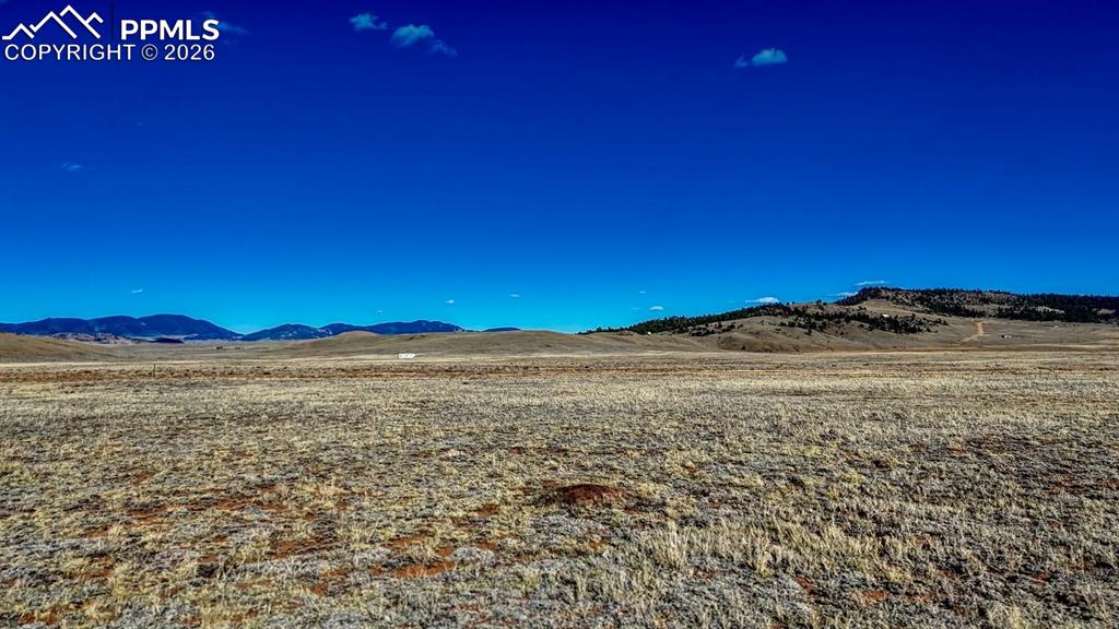 a view of an ocean beach and mountain