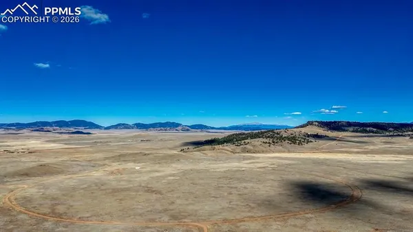 a view of an ocean beach and mountain