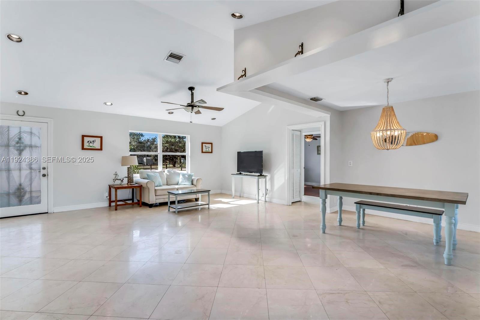 17607 88th Road North Loxahatchee, FL 33470 - Photo 12 of 56 a view of a livingroom with furniture and a ceiling fan