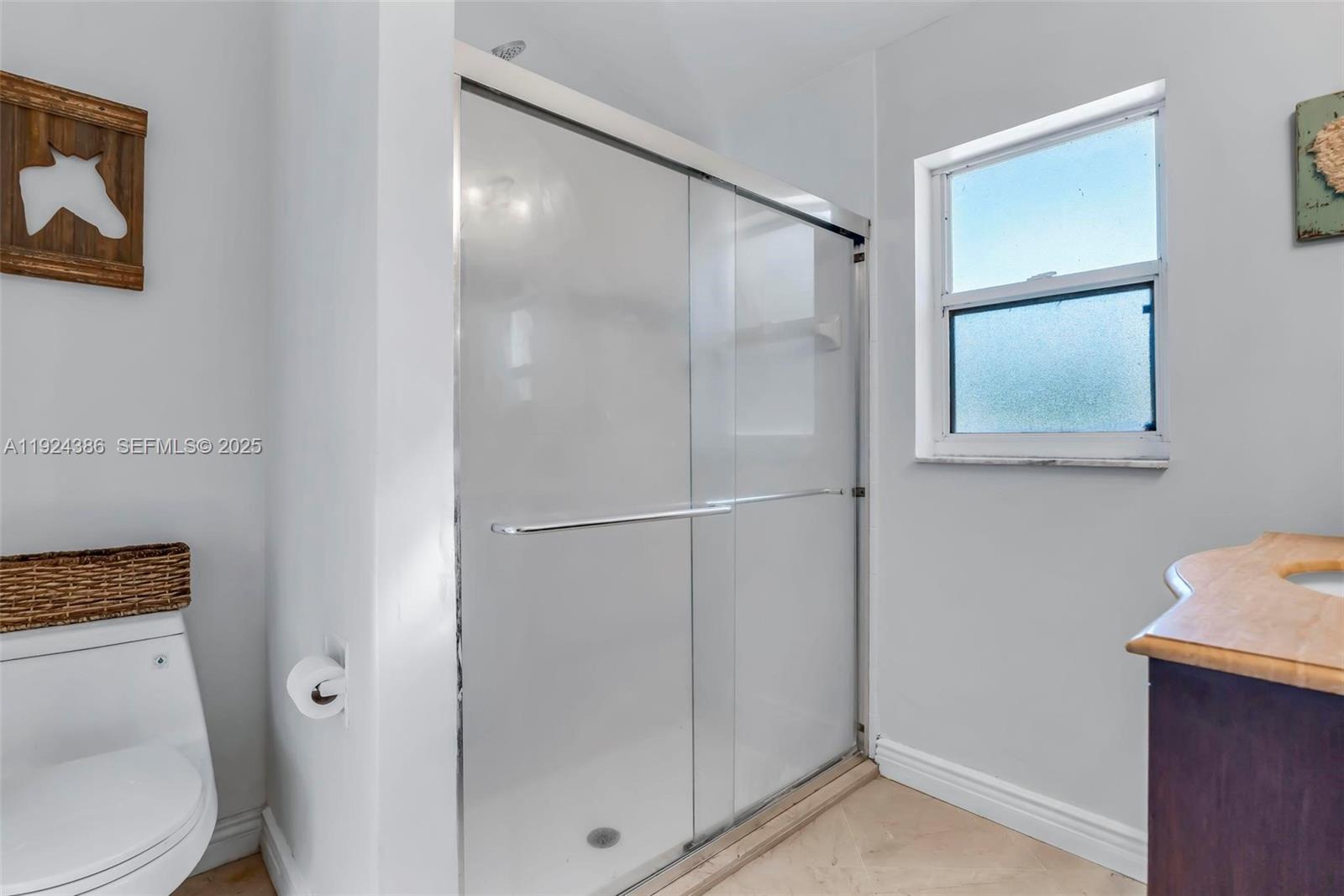 17607 88th Road North Loxahatchee, FL 33470 - Photo 23 of 56 a bathroom with a shower and a toilet