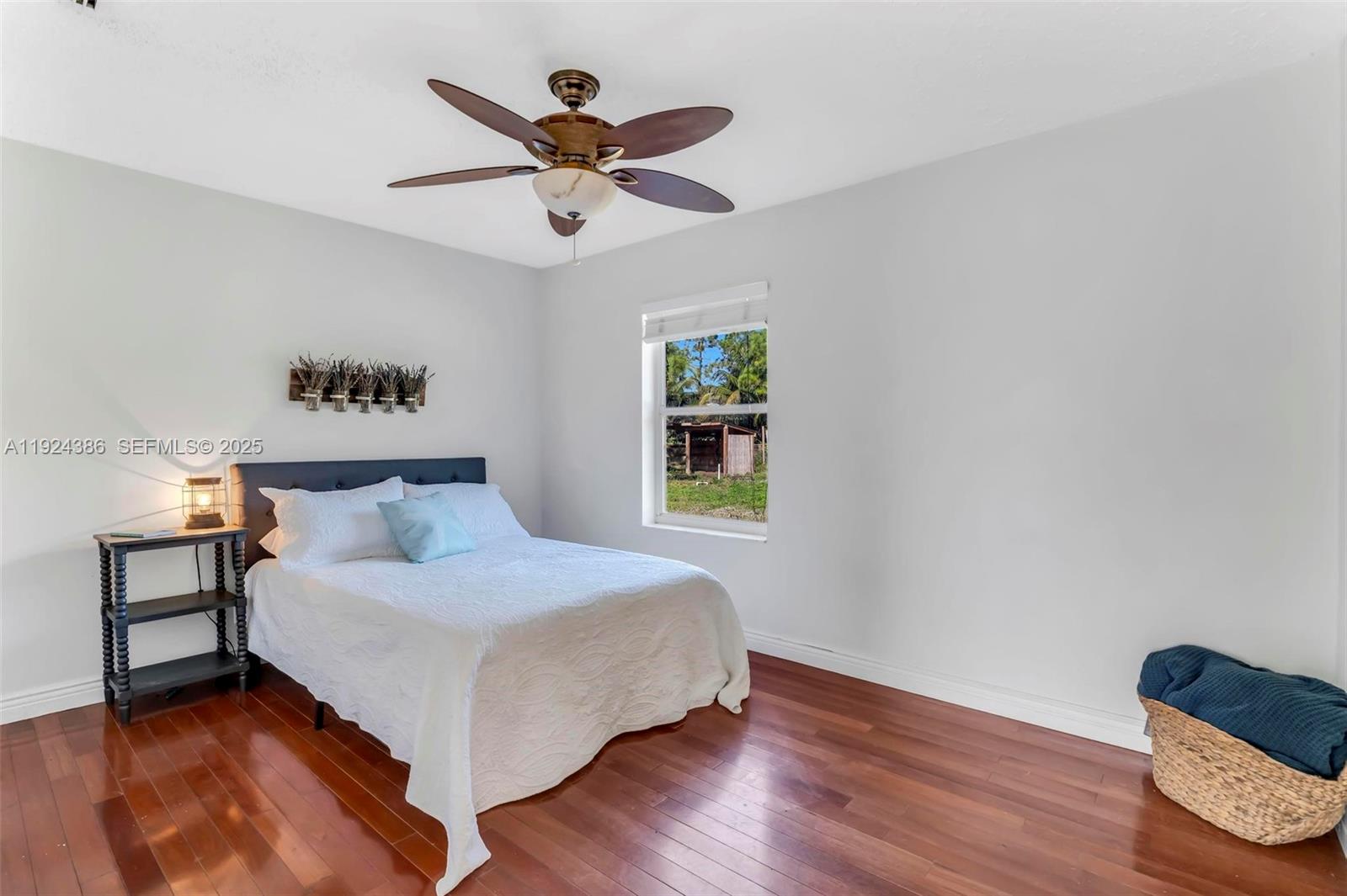 17607 88th Road North Loxahatchee, FL 33470 - Photo 25 of 56 a bedroom with a bed and a window