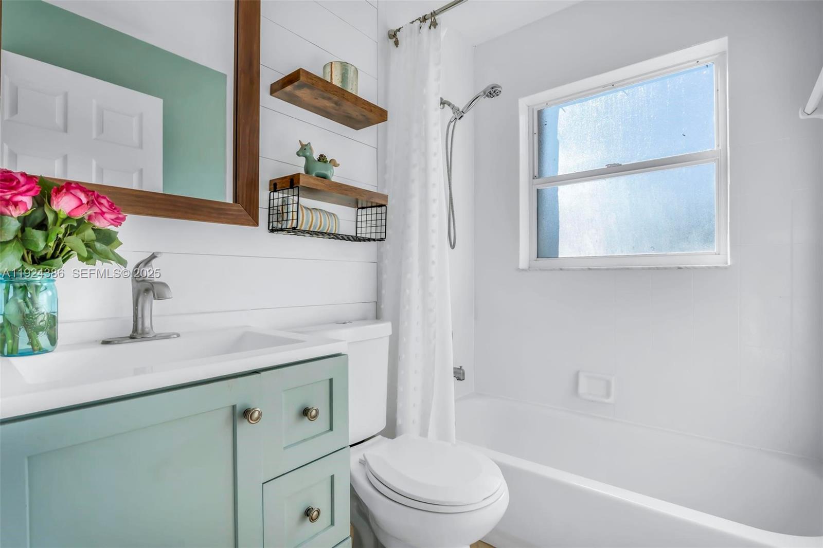 17607 88th Road North Loxahatchee, FL 33470 - Photo 27 of 56 a bathroom with a granite countertop sink a toilet and a mirror