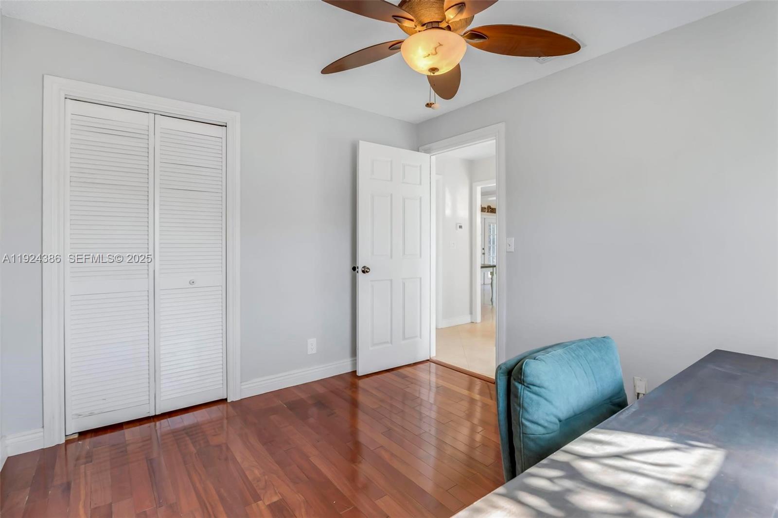 17607 88th Road North Loxahatchee, FL 33470 - Photo 30 of 56 a living room with furniture and a wooden floor