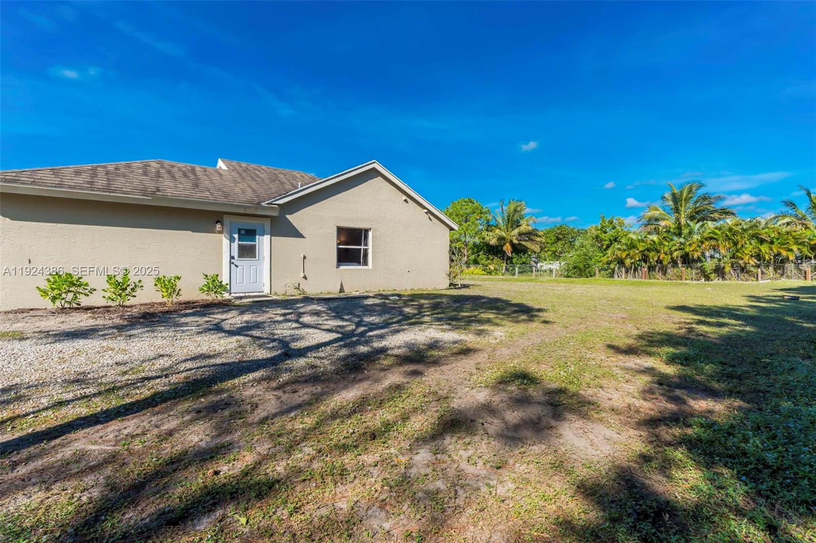 17607 88th Road North Loxahatchee, FL 33470 - Photo 34 of 56 a view of a house with a yard