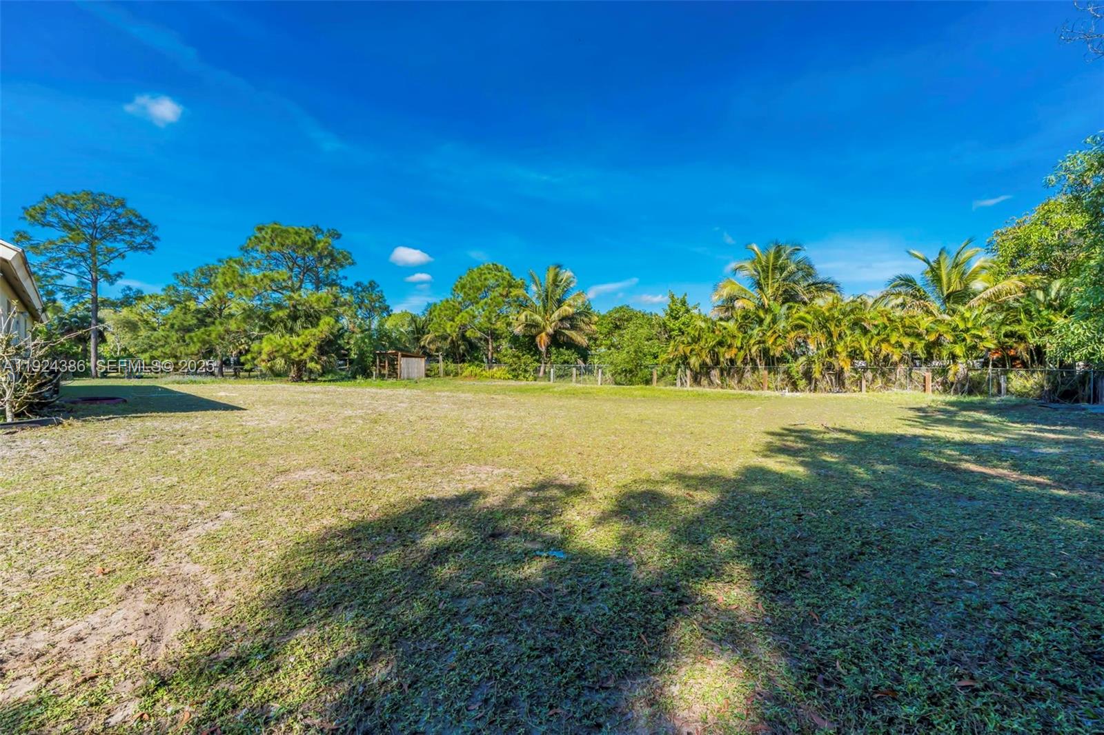 17607 88th Road North Loxahatchee, FL 33470 - Photo 38 of 56 a view of yard with swimming pool and green space