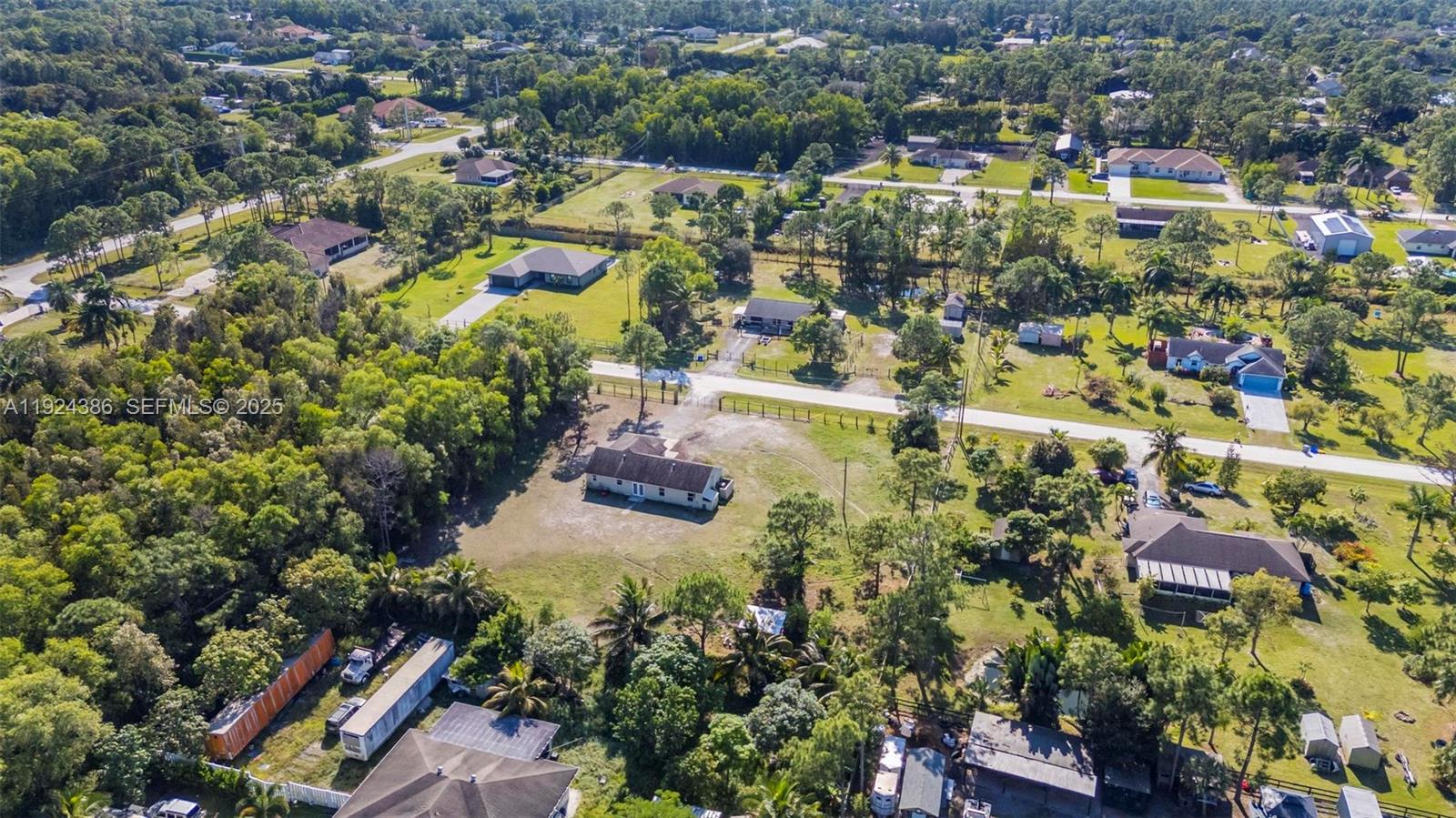 17607 88th Road North Loxahatchee, FL 33470 - Photo 44 of 56 an aerial view of residential houses with outdoor space
