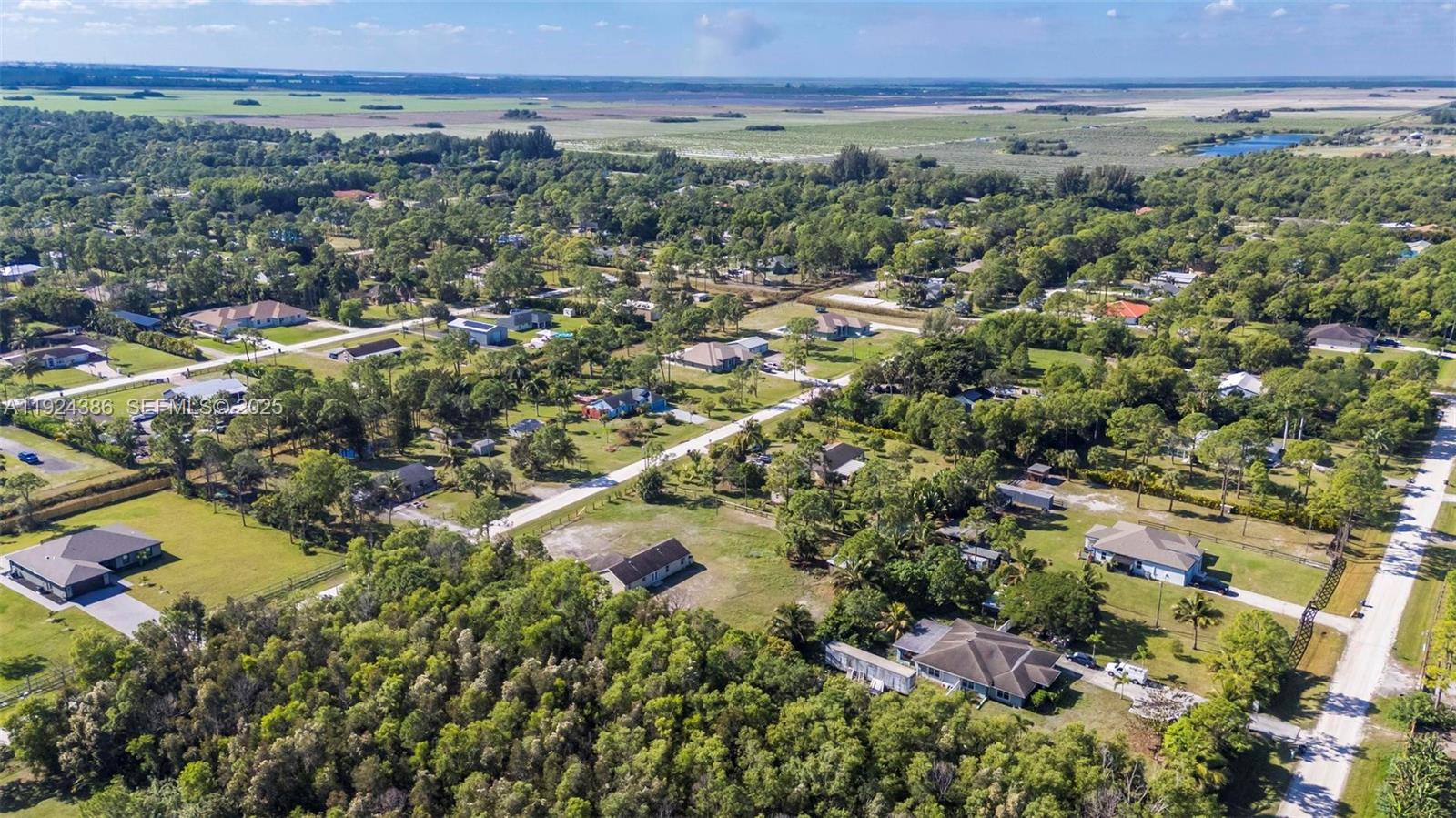 17607 88th Road North Loxahatchee, FL 33470 - Photo 47 of 56 an aerial view of a city and mountains