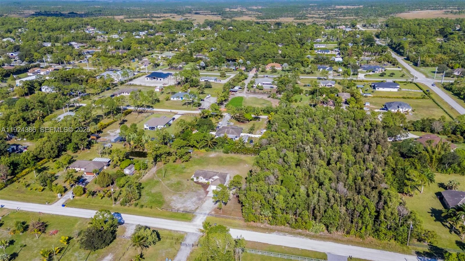 17607 88th Road North Loxahatchee, FL 33470 - Photo 50 of 56 an aerial view of residential houses with outdoor space
