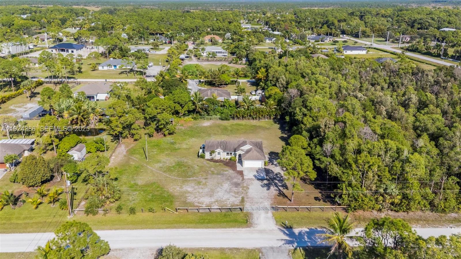 17607 88th Road North Loxahatchee, FL 33470 - Photo 5 of 56 an aerial view of residential houses with outdoor space