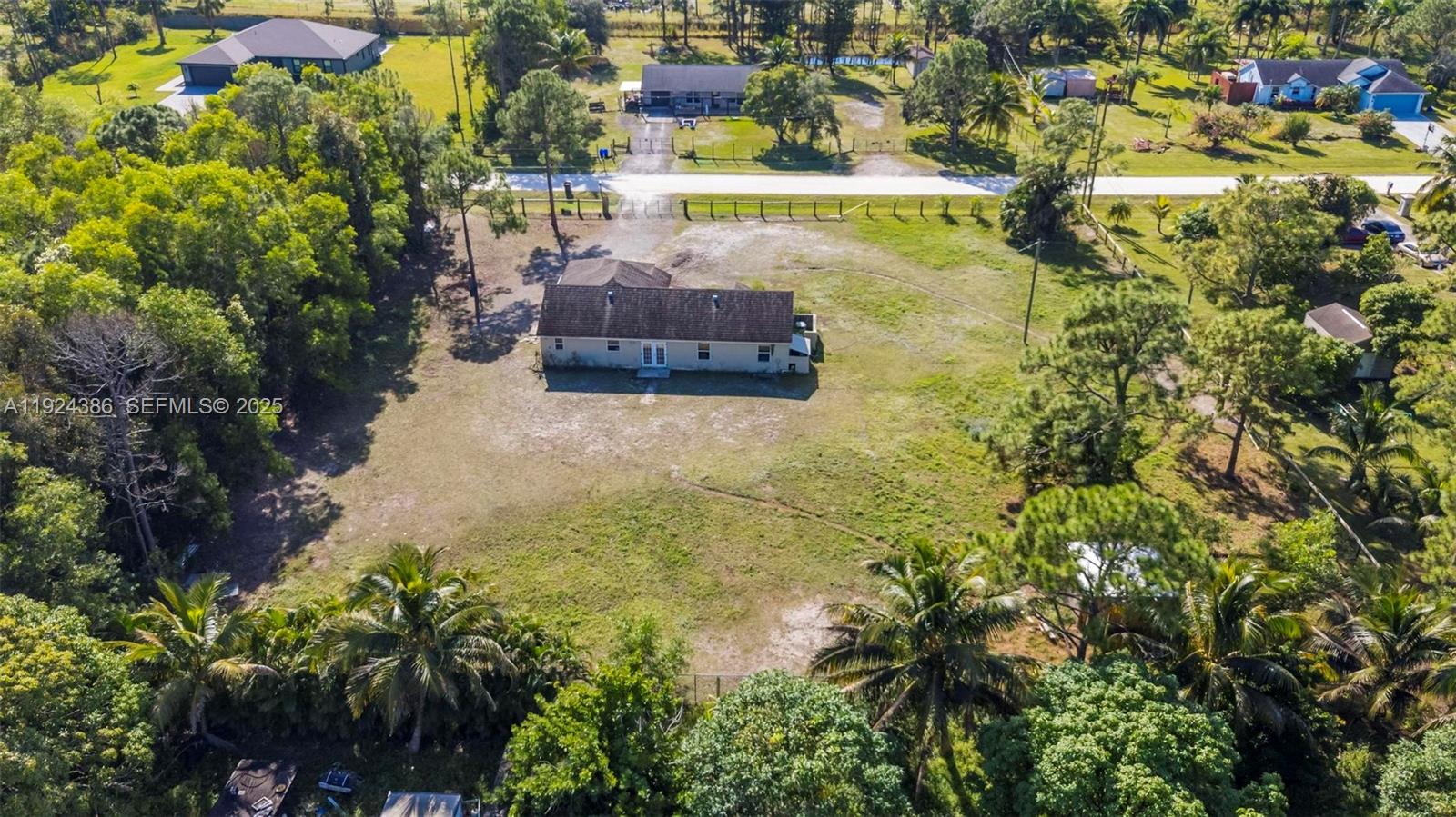 17607 88th Road North Loxahatchee, FL 33470 - Photo 7 of 56 a view of a lake with a building in the background