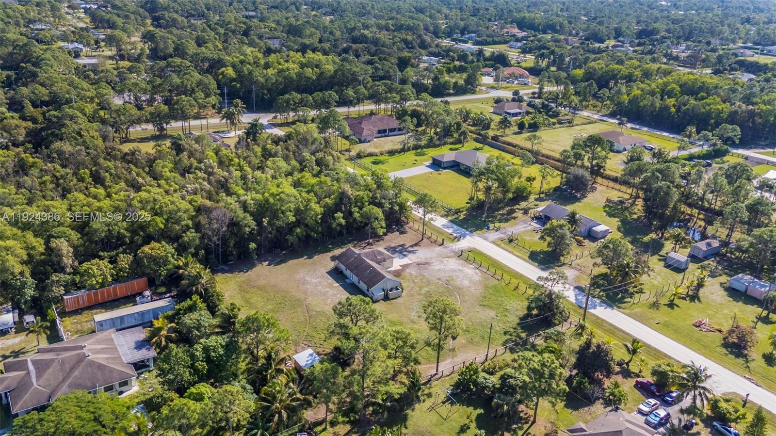17607 88th Road North Loxahatchee, FL 33470 - Photo 8 of 56 an aerial view of residential houses with outdoor space