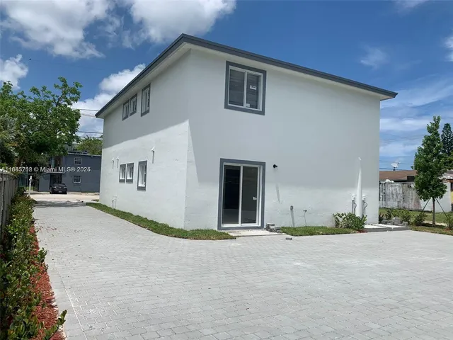 a view of garage and yard