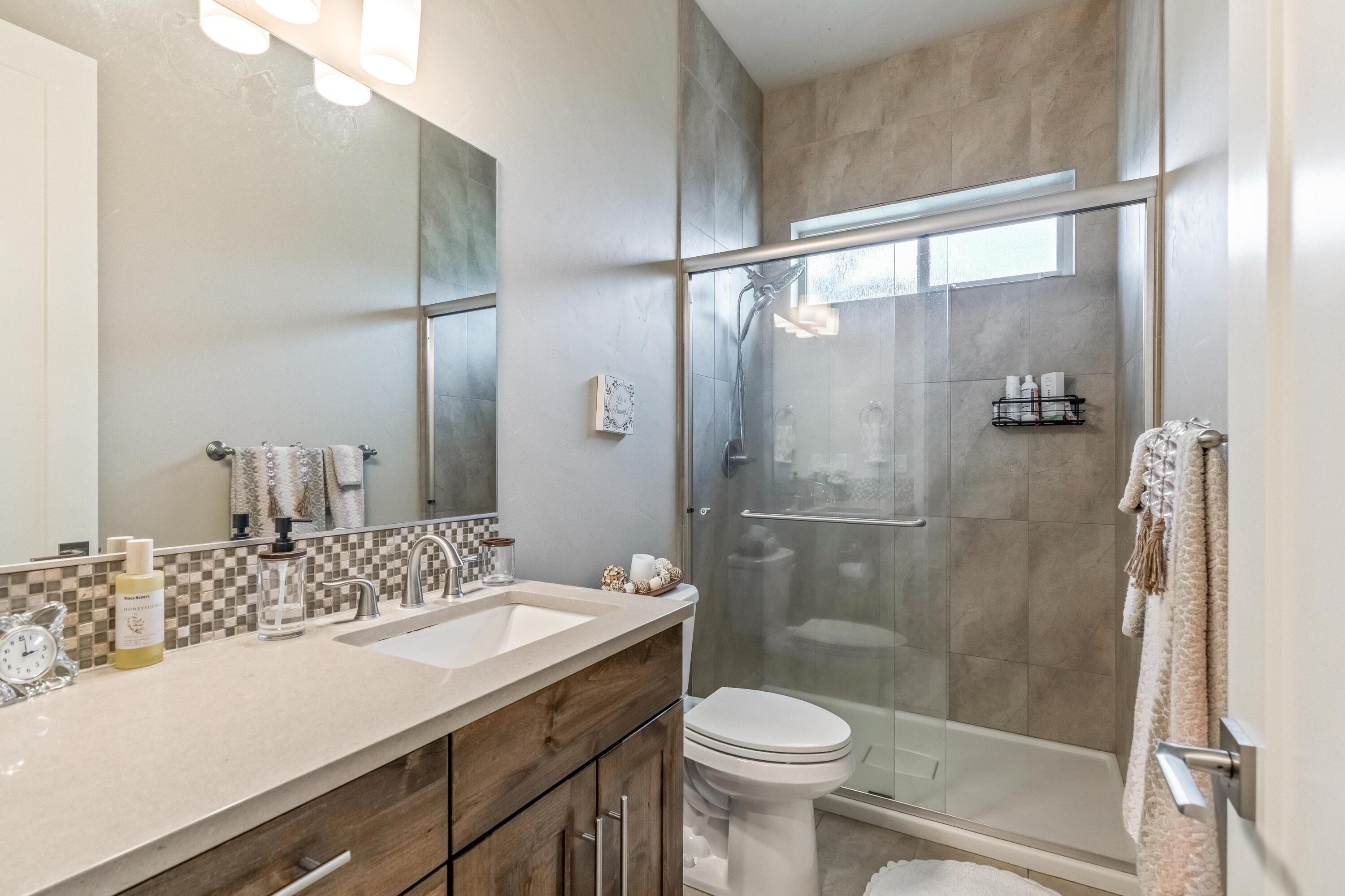 2375 Northwest Majestic Ridge Drive Bend, OR 97703 - Photo 14 of 28 a bathroom with a sink and a mirror