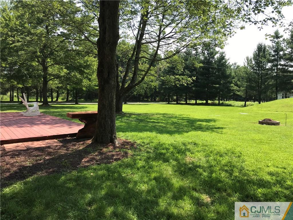 133 Allens Corner Road Flemington, NJ 08822 - Photo 11 of 13 a view of a big yard with large trees