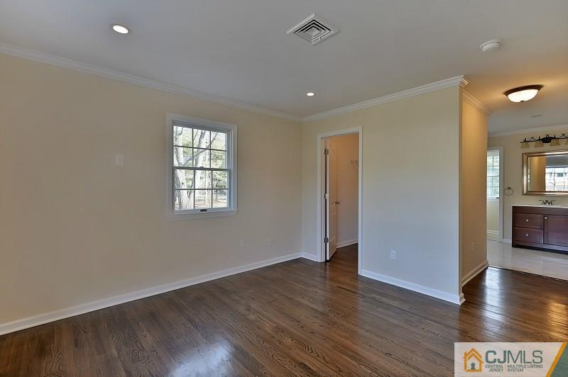 133 Allens Corner Road Flemington, NJ 08822 - Photo 6 of 13 an empty room with wooden floor and windows