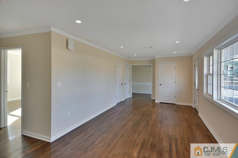 133 Allens Corner Road Flemington, NJ 08822 - Photo 7 of 13 a view of an empty room with wooden floor and a window