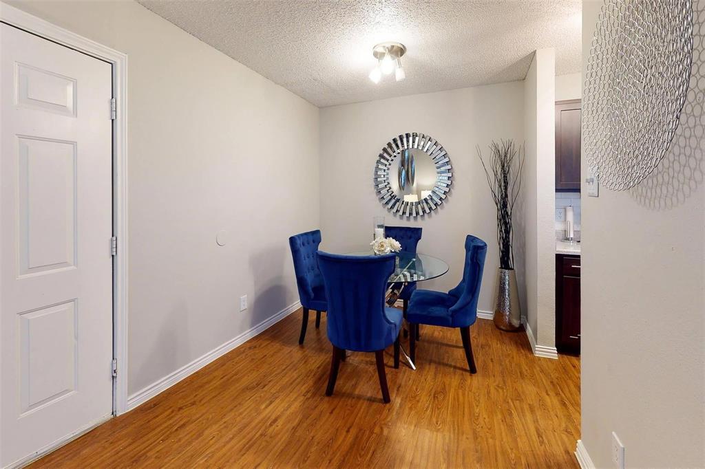 1826 Esters Road, Unit 1050 Irving, TX 75061 - Photo 10 of 39 Wood-finish flooring with a neutral wall color, recessed lighting, and a white paneled door