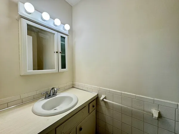 a bathroom with a sink and a mirror