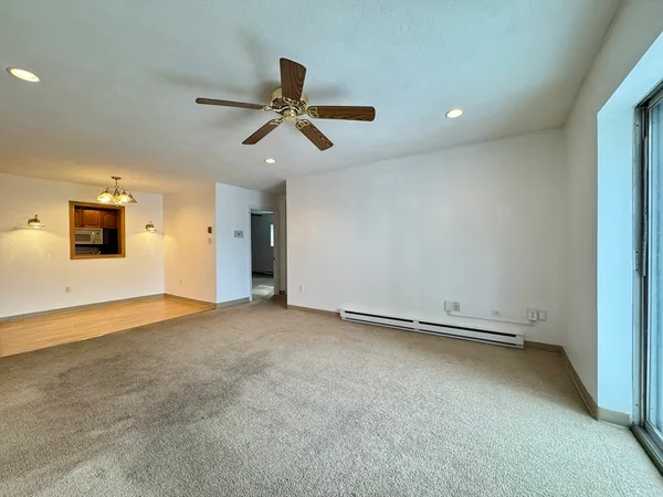 an empty room with a empty space and windows