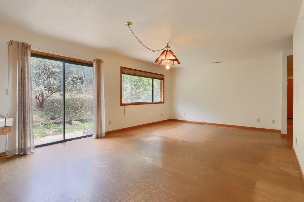 51973 Montgomery Drive Oakhurst, CA 93644 - Photo 15 of 50 an empty room with windows