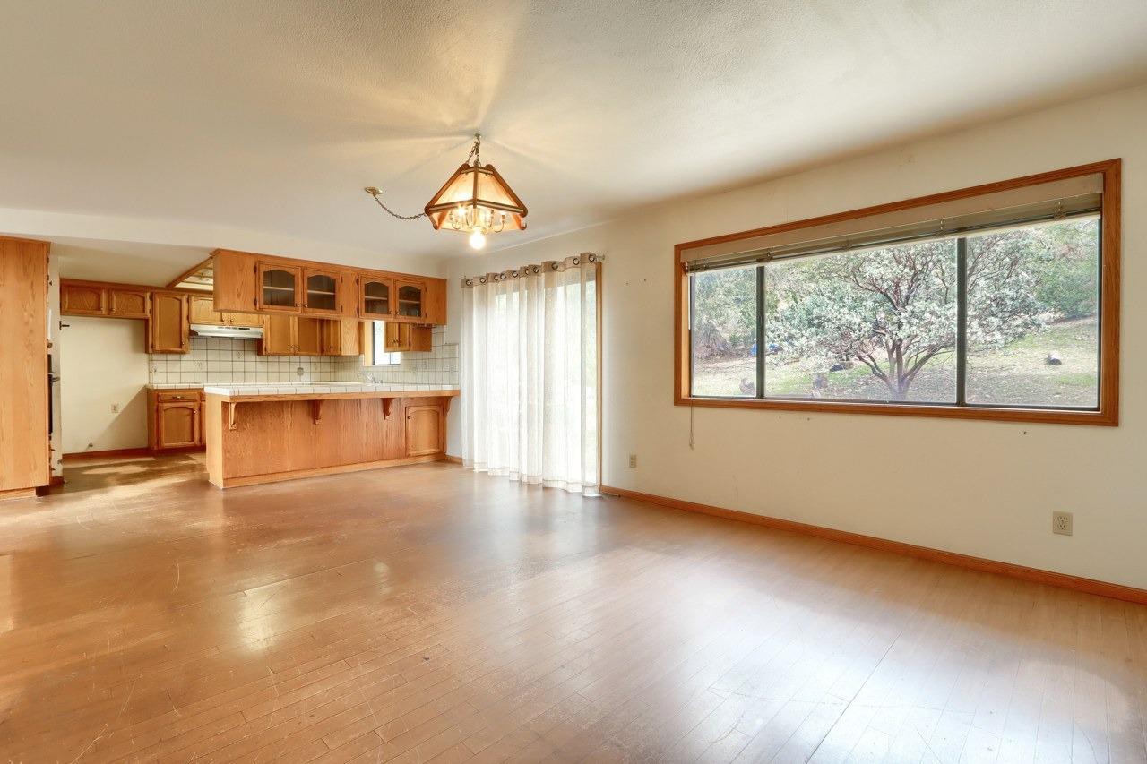 51973 Montgomery Drive Oakhurst, CA 93644 - Photo 16 of 50 a view of empty room with a kitchen