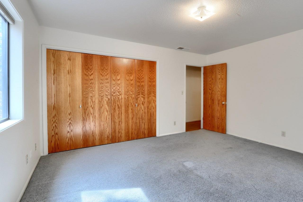 51973 Montgomery Drive Oakhurst, CA 93644 - Photo 30 of 50 an empty room with a wooden door