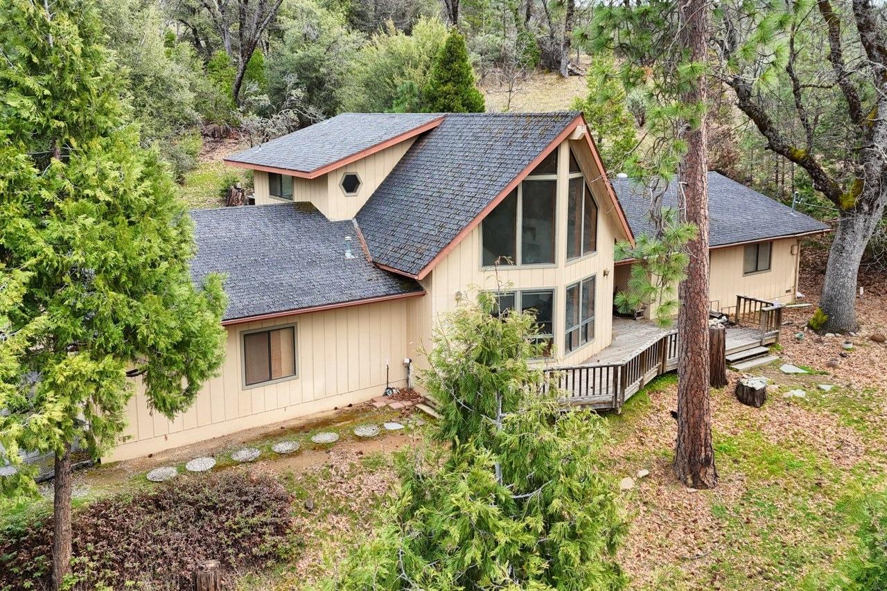 51973 Montgomery Drive Oakhurst, CA 93644 - Photo 3 of 50 a aerial view of a house with a yard and sitting area