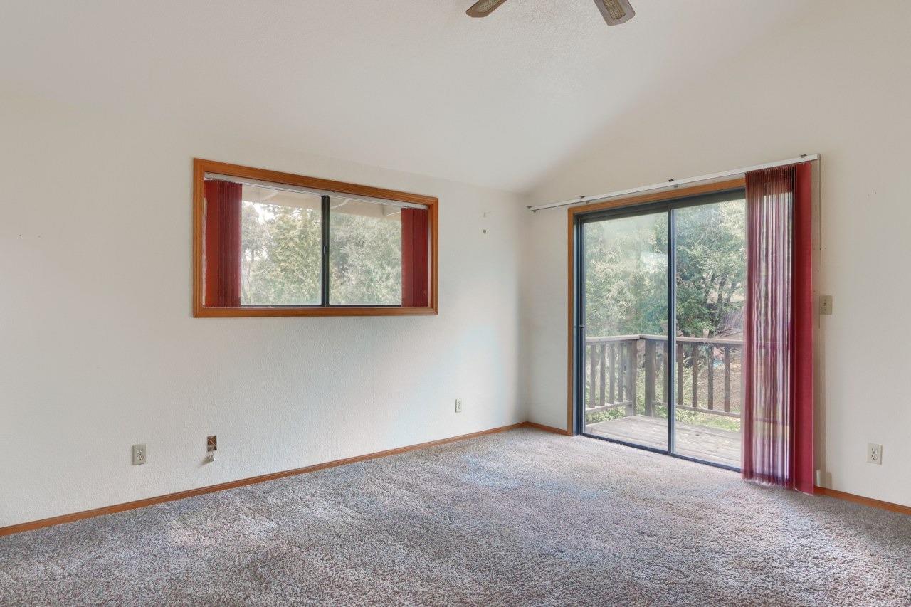 51973 Montgomery Drive Oakhurst, CA 93644 - Photo 33 of 50 an empty room with windows