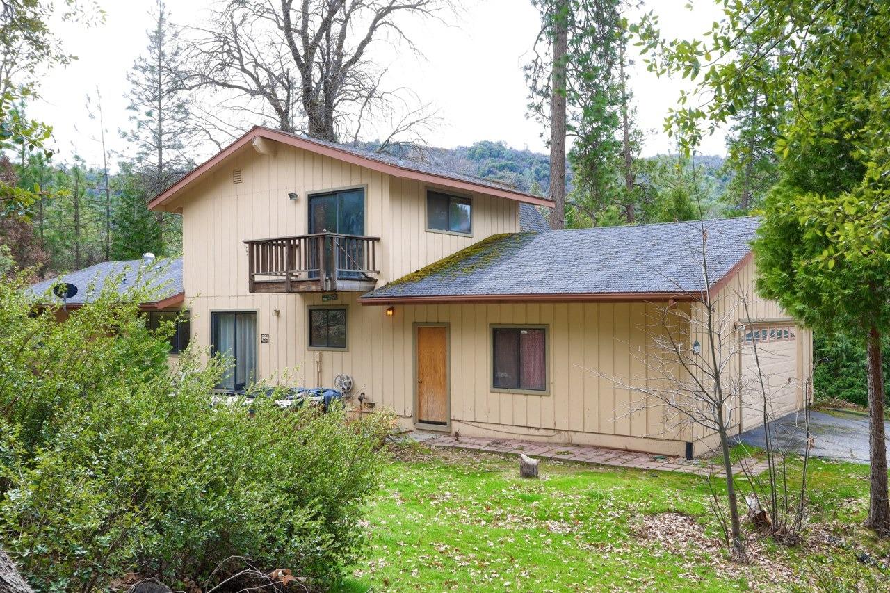 51973 Montgomery Drive Oakhurst, CA 93644 - Photo 39 of 50 a view of a house with yard and plants