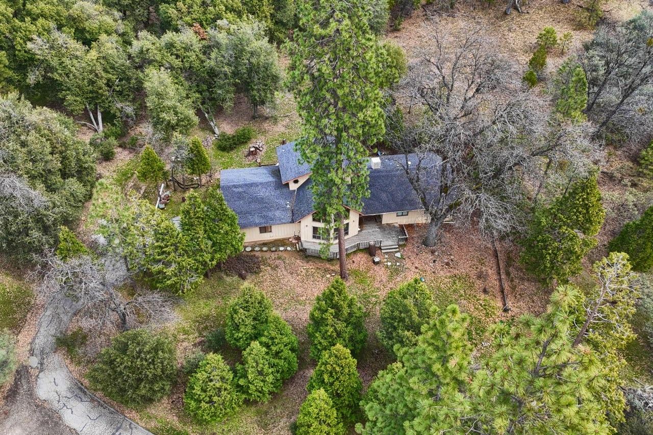 51973 Montgomery Drive Oakhurst, CA 93644 - Photo 40 of 50 an aerial view of a house with a yard