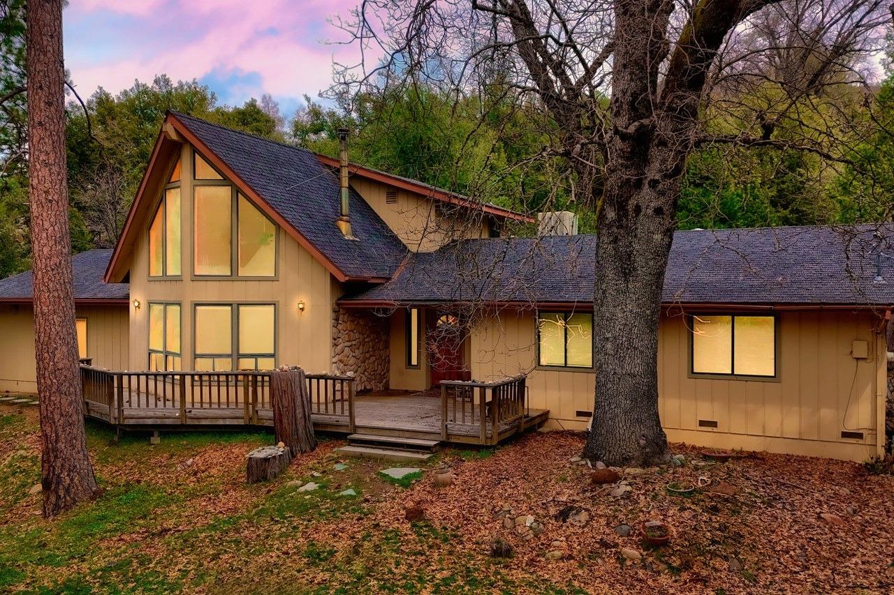 51973 Montgomery Drive Oakhurst, CA 93644 - Photo 4 of 50 a backyard of a house with barbeque oven