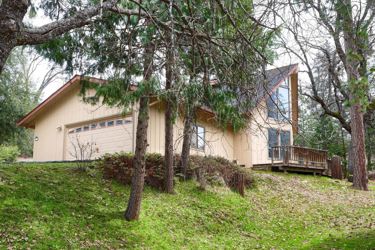 51973 Montgomery Drive Oakhurst, CA 93644 - Photo 41 of 50 a front view of a house with garden