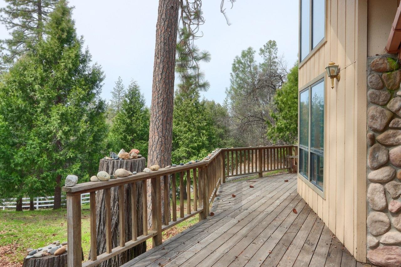 51973 Montgomery Drive Oakhurst, CA 93644 - Photo 42 of 50 a view of balcony with wooden floor and fence