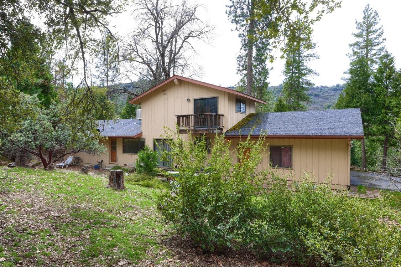 51973 Montgomery Drive Oakhurst, CA 93644 - Photo 7 of 50 a house view with a garden space