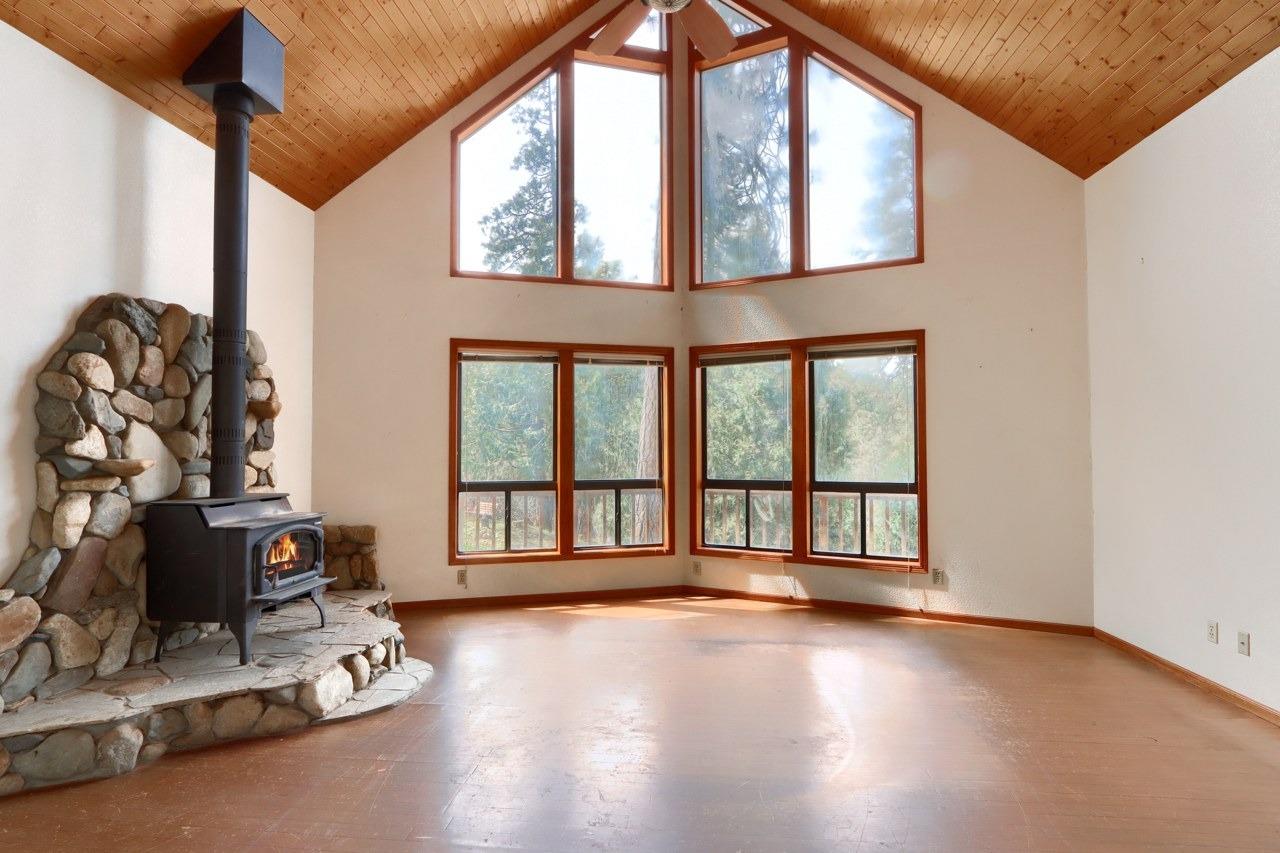 51973 Montgomery Drive Oakhurst, CA 93644 - Photo 8 of 50 a view of an empty room with a window