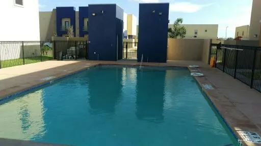 a view of a house with backyard