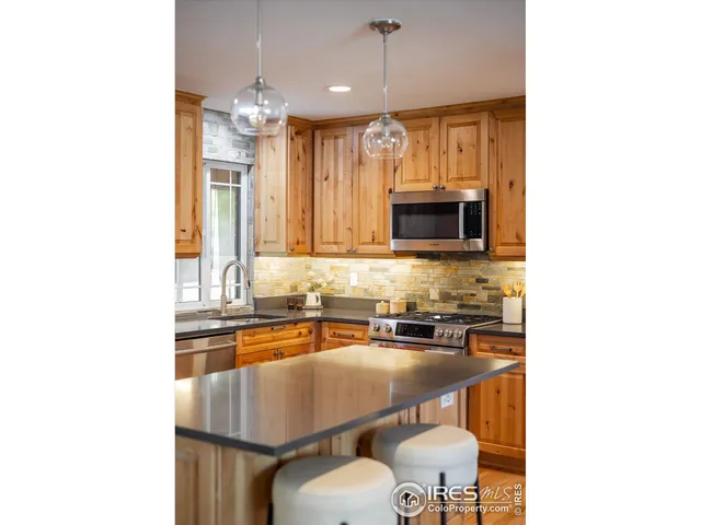 a kitchen with a sink cabinets and window