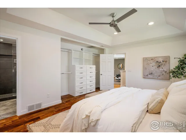 a bedroom with a bed and a view of bathroom