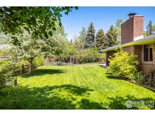 a view of house with a garden