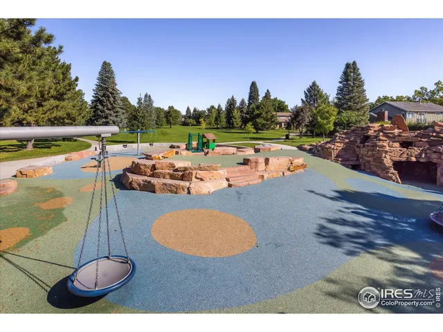 a view of a house with a yard and a car