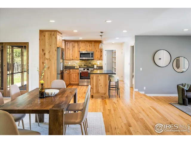 a open kitchen with a table and chairs