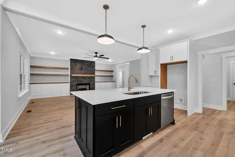 a kitchen with a sink and stove