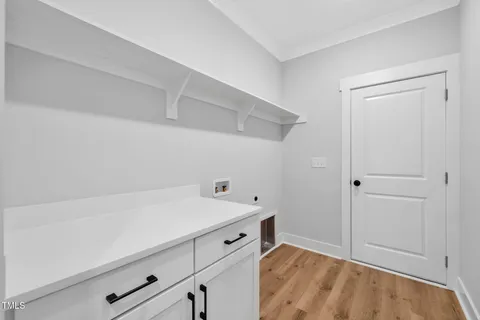 an empty room with closet and windows