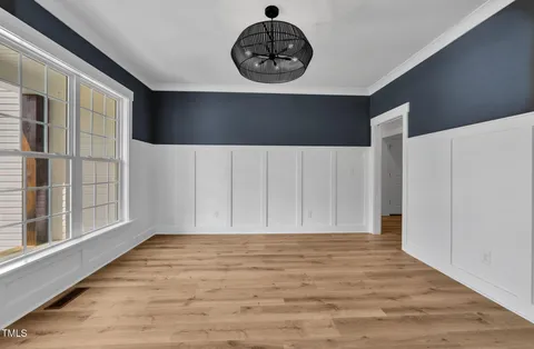 a view of wooden floor and a window